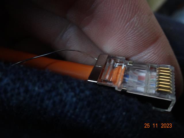 Cat6a shielded connector crimped with drain wire exposed